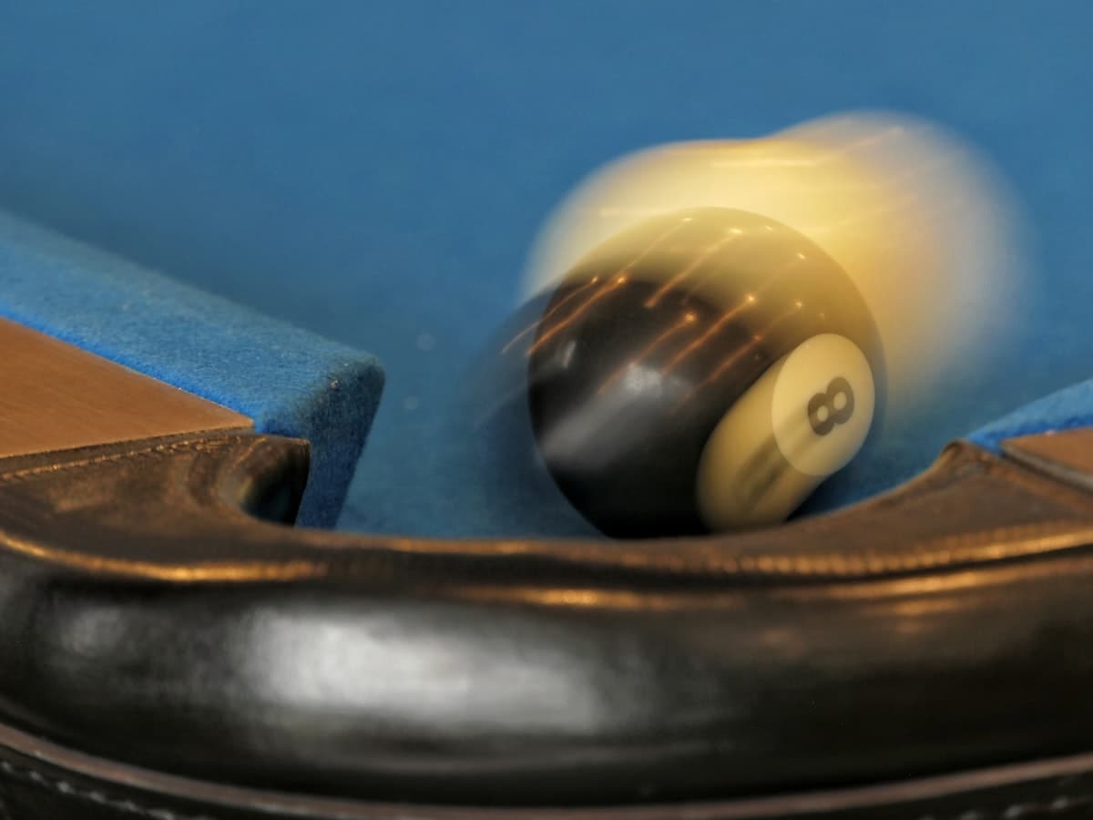 Pool table with cues and balls